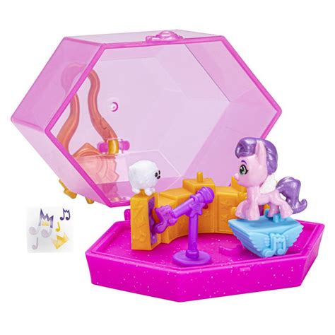 Collectible keychains featuring miniature pony figures and magic crystal accents